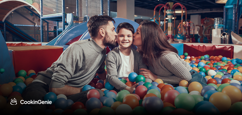 Family playing in a ball pit
