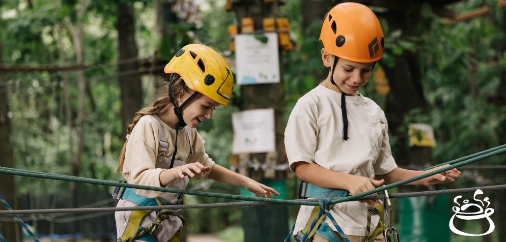 Kids in helmets at an adventure park