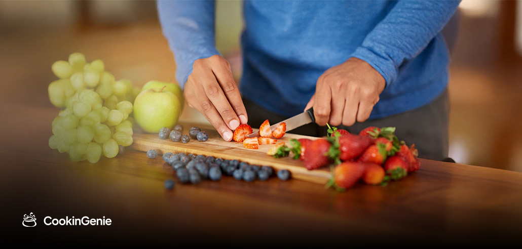 Personal chef slicing fresh strawberries