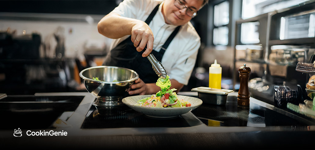 Personal chef plating a fresh gourmet meal at home