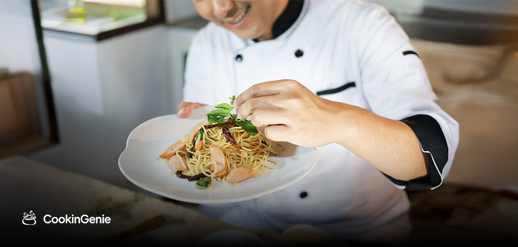 Private chef plating Italian pasta dish
