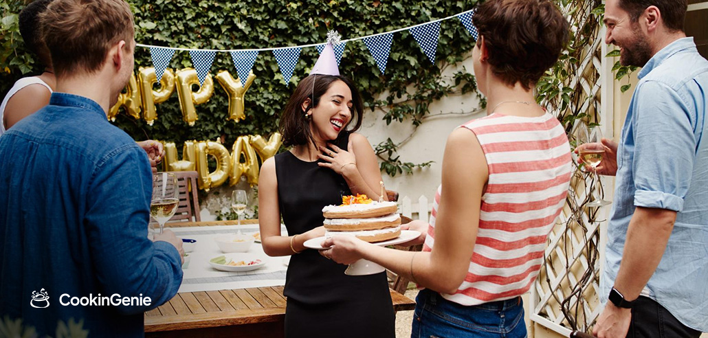 Woman celebrating her 50th birthday with friends at an outdoor party