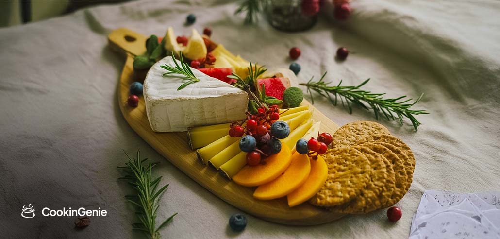 Vegan charcuterie board with fruits, crackers, and plant-based cheese