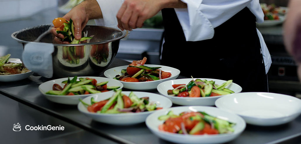 Personal chef plating fresh salad courses for a private dinner in Ohio
