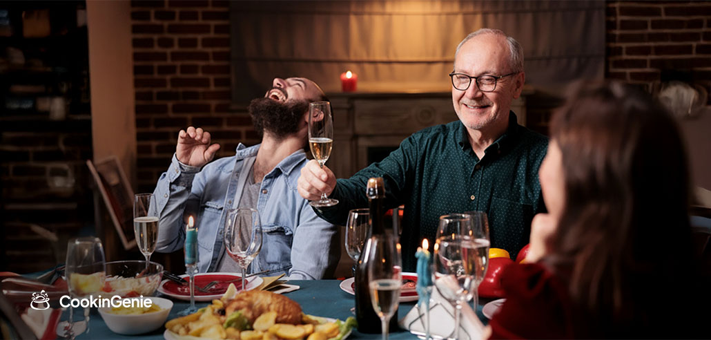 Family laughing and toasting at a private chef dinner at home on Father's Day