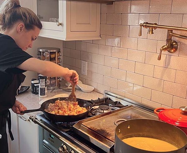 Female private chef cooking in an Ohio home kitchen