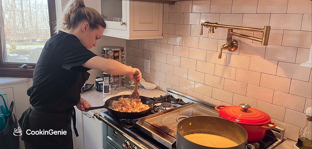 Female private chef cooking in an Ohio home kitchen