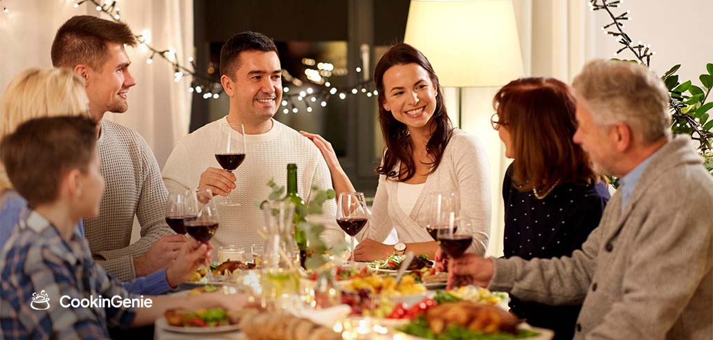 Family enjoying a private chef-prepared dinner at home in Fountain Valley with wine and fresh meals on the table